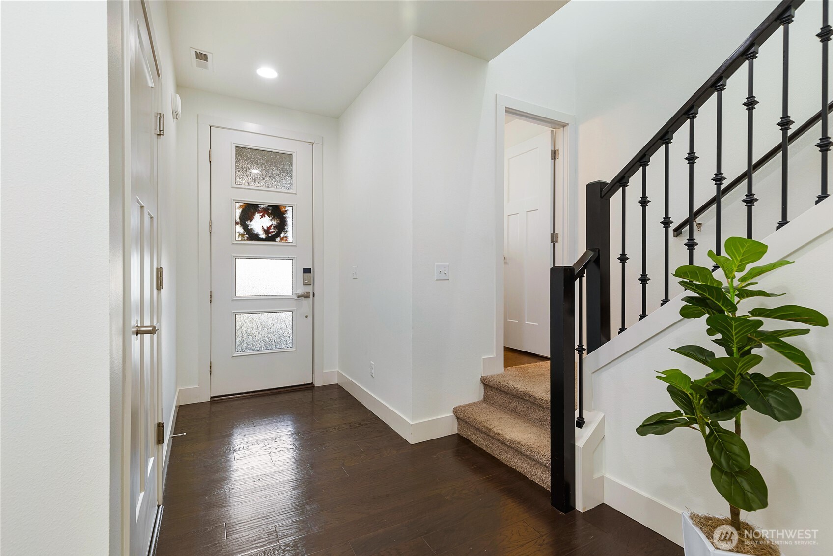 4214 223rd Place Southeast Bothell, WA 98021 - Photo 5 of 37 a view of an entryway with wooden floor