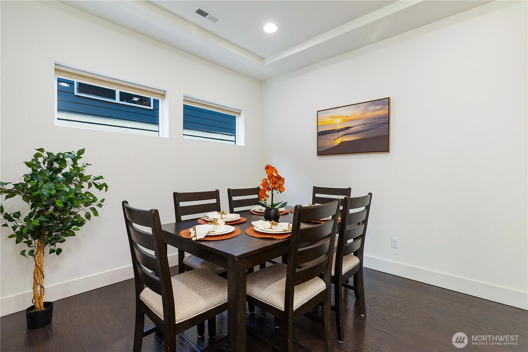 4214 223rd Place Southeast Bothell, WA 98021 - Photo 10 of 37 a dining room with furniture and potted plants