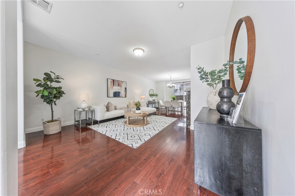 454 West Duarte Road, Unit D Arcadia, CA 91007 - Photo 3 of 27 a living room with furniture a potted plant and a wooden floor