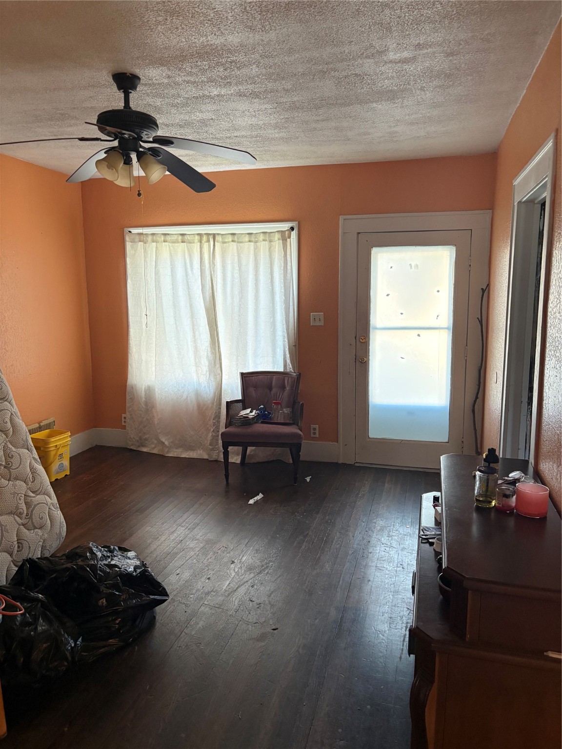 1564 Godwin Street Houston, TX 77023 - Photo 4 of 12 a living room with furniture and a window