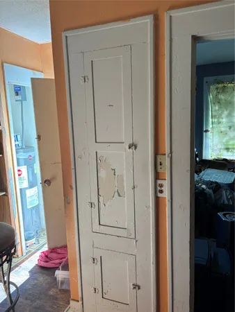 a view of an entryway with wooden floor