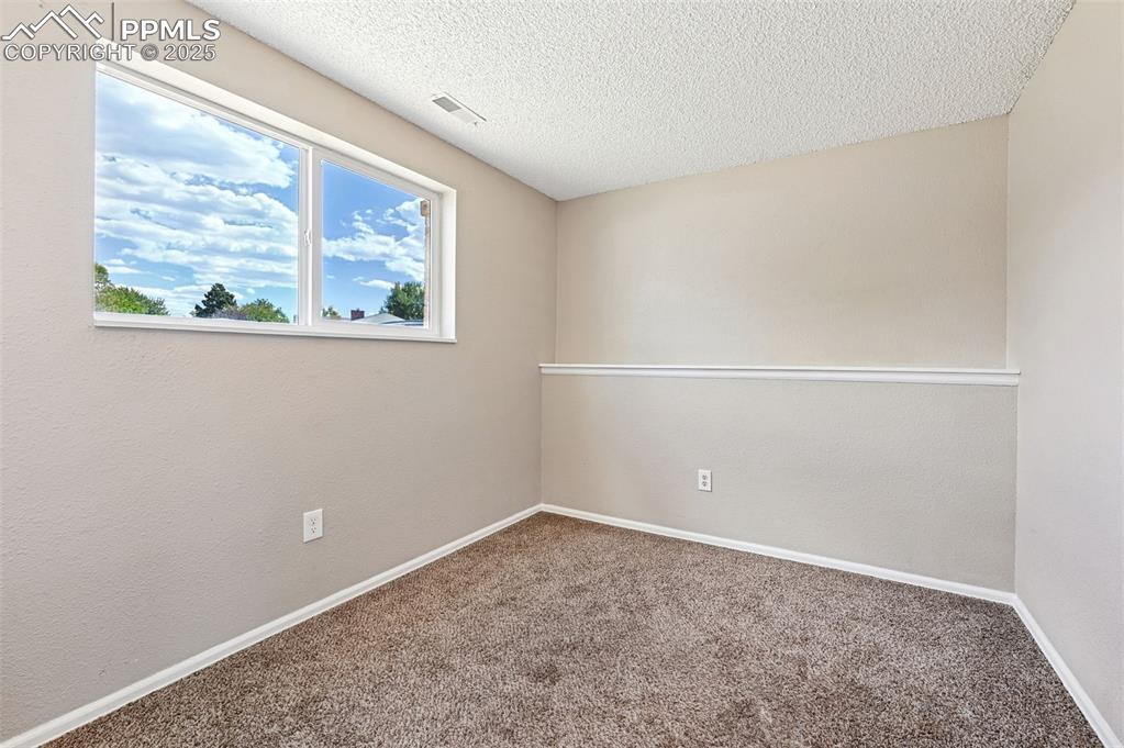 1248 Jet Wing Drive Colorado Springs, CO 80916 - Photo 12 of 25 an empty room with a window
