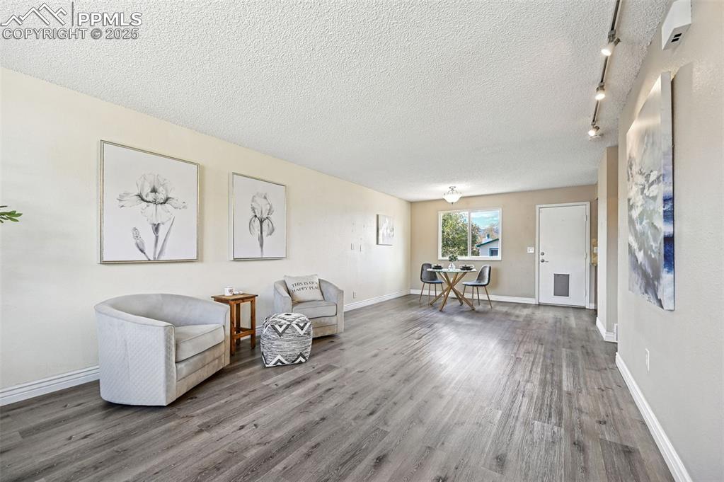 1248 Jet Wing Drive Colorado Springs, CO 80916 - Photo 23 of 25 a living room with furniture and wooden floor