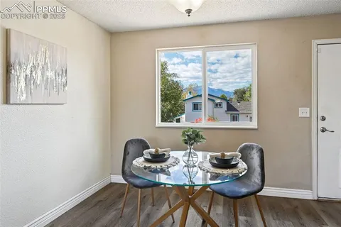 a dining room with furniture and window