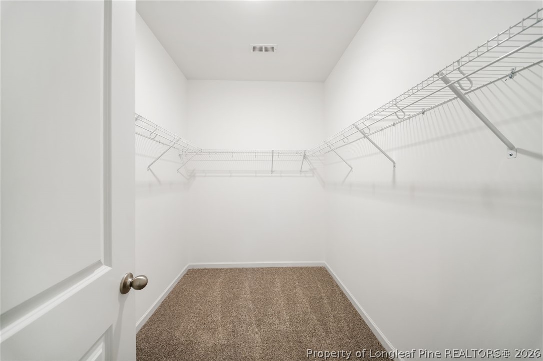 4038 Lofton Street Wade, NC 28395 - Photo 18 of 29 a view of a room with racks on the wall