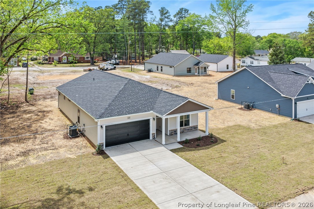 4038 Lofton Street Wade, NC 28395 - Photo 20 of 29 a view of a house with a yard and sitting area