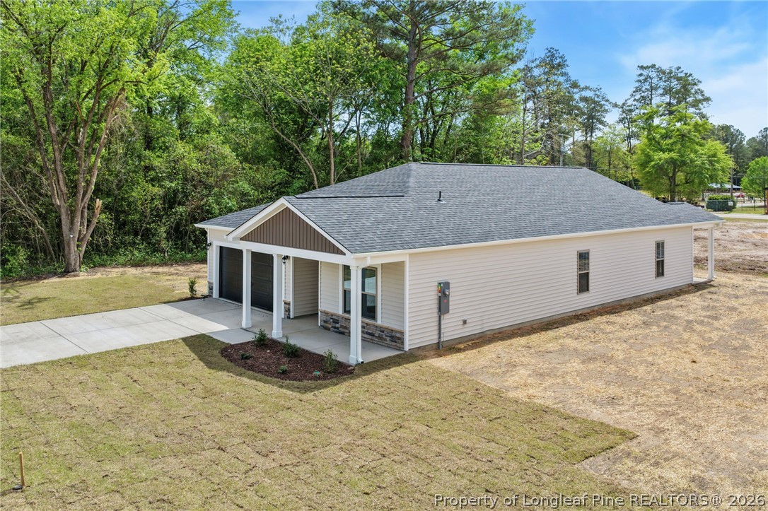 4038 Lofton Street Wade, NC 28395 - Photo 21 of 29 a house with trees in the background