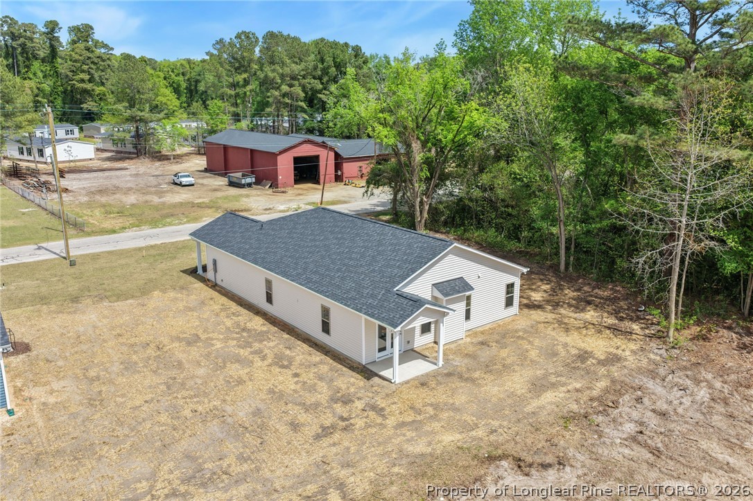 4038 Lofton Street Wade, NC 28395 - Photo 23 of 29 a house with trees in the background