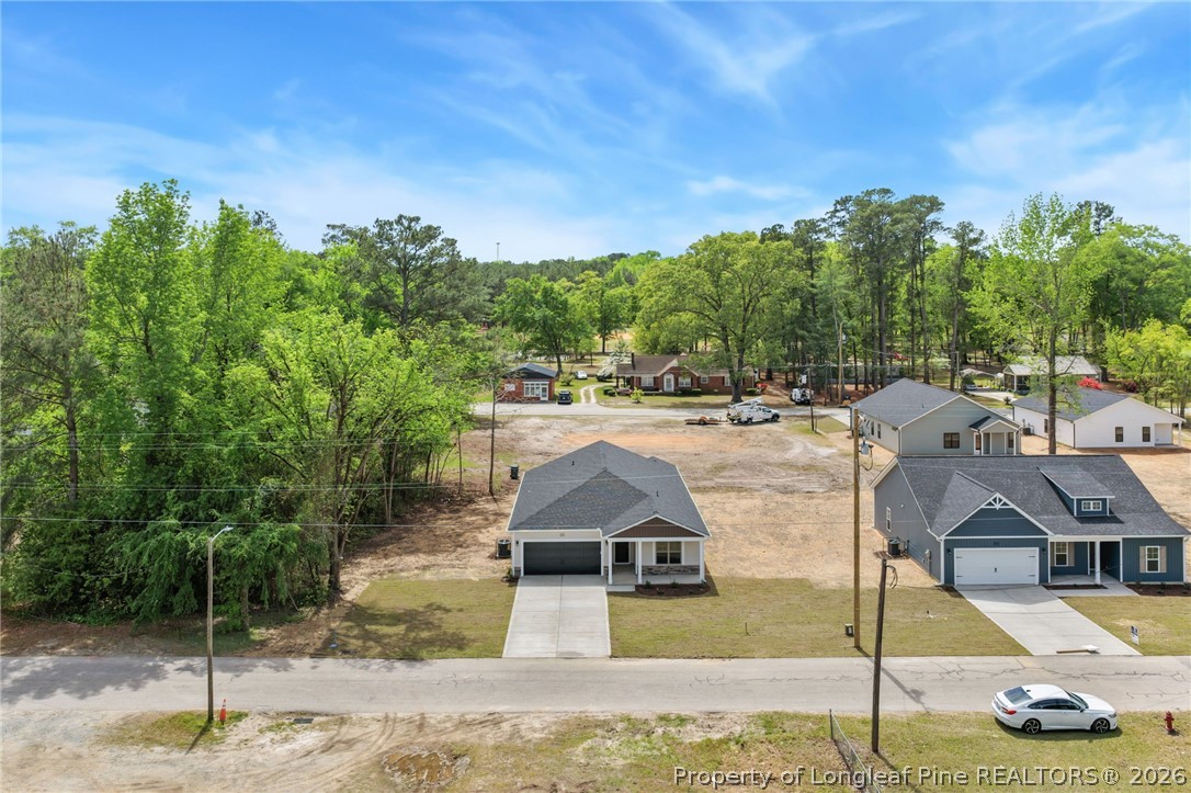 4038 Lofton Street Wade, NC 28395 - Photo 24 of 29 a swimming pool with some trees in the background