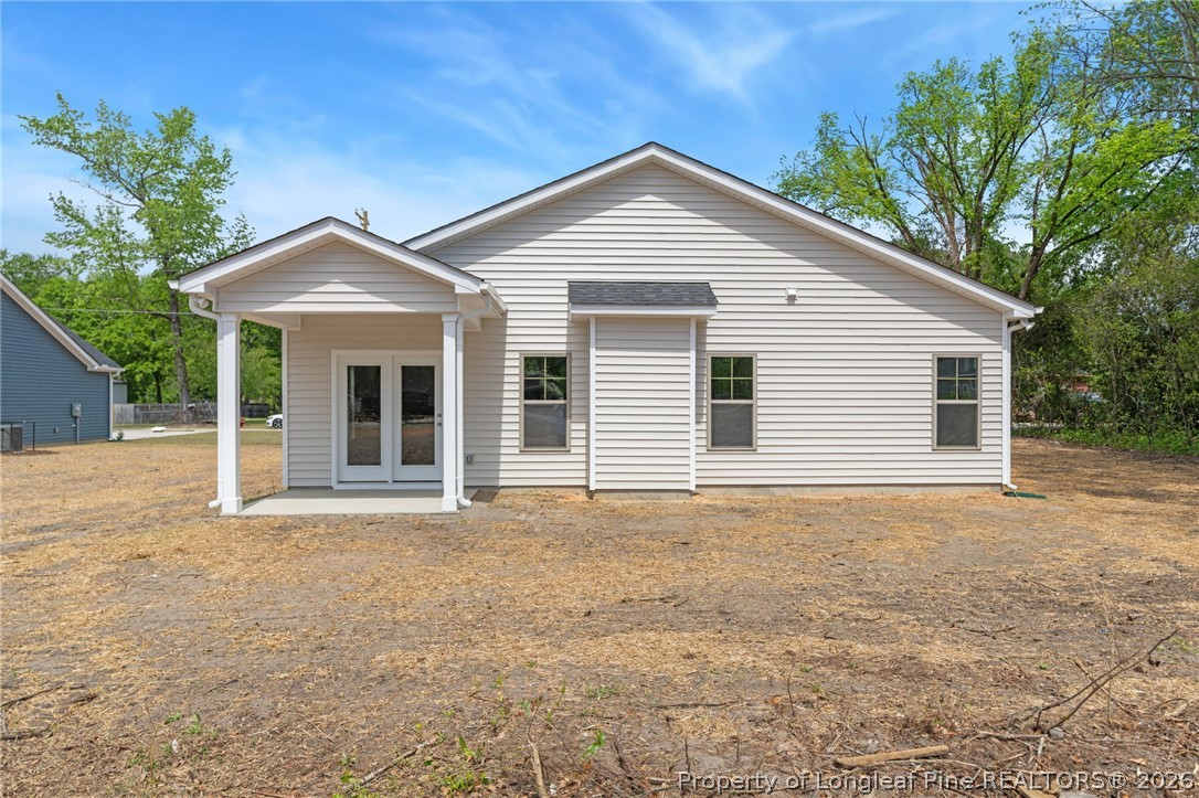 4038 Lofton Street Wade, NC 28395 - Photo 29 of 29 a front view of a house with a garden