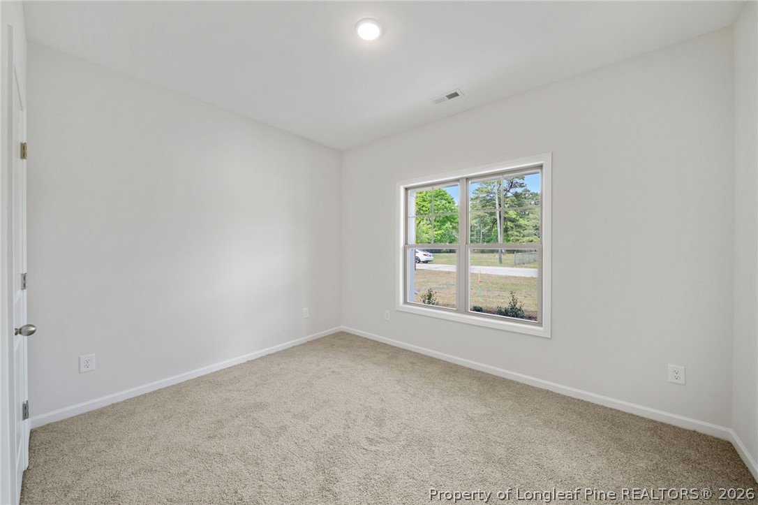 4038 Lofton Street Wade, NC 28395 - Photo 8 of 29 an empty room with windows