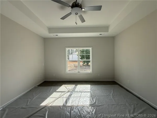 a view of empty room with windows