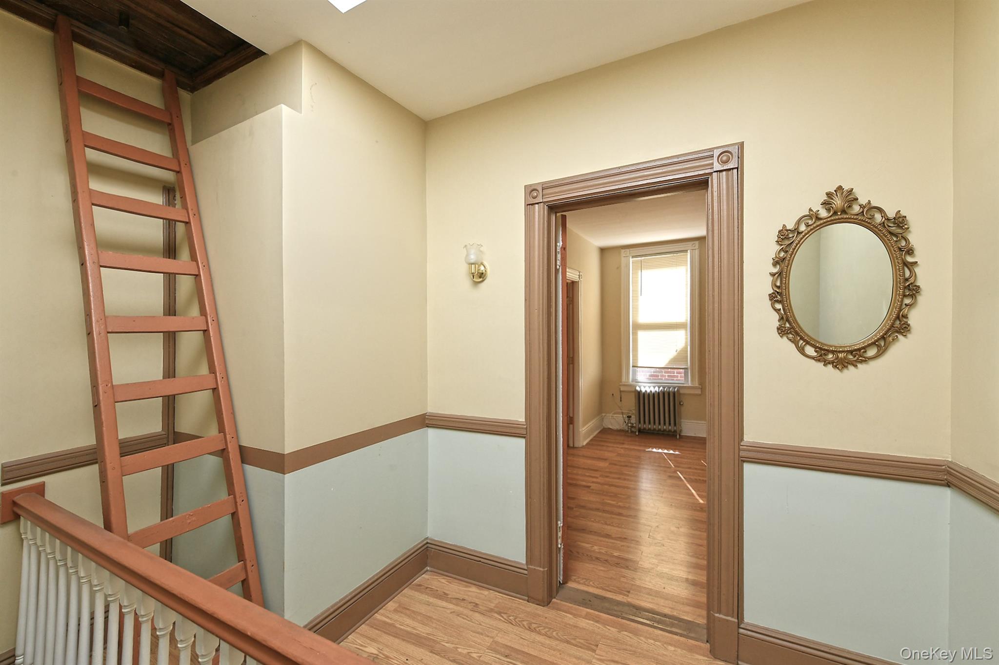 30-94 47th Street Queens, NY 11103 - Photo 12 of 20 Hallway featuring light wood-style floors and radiator