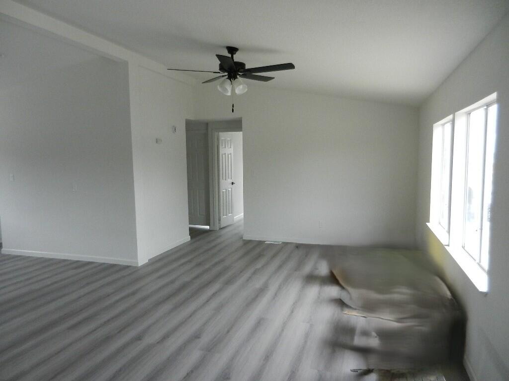 98920 Surfside Avenue Mecca, CA 92254 - Photo 11 of 22 wooden floor in an empty room with a window