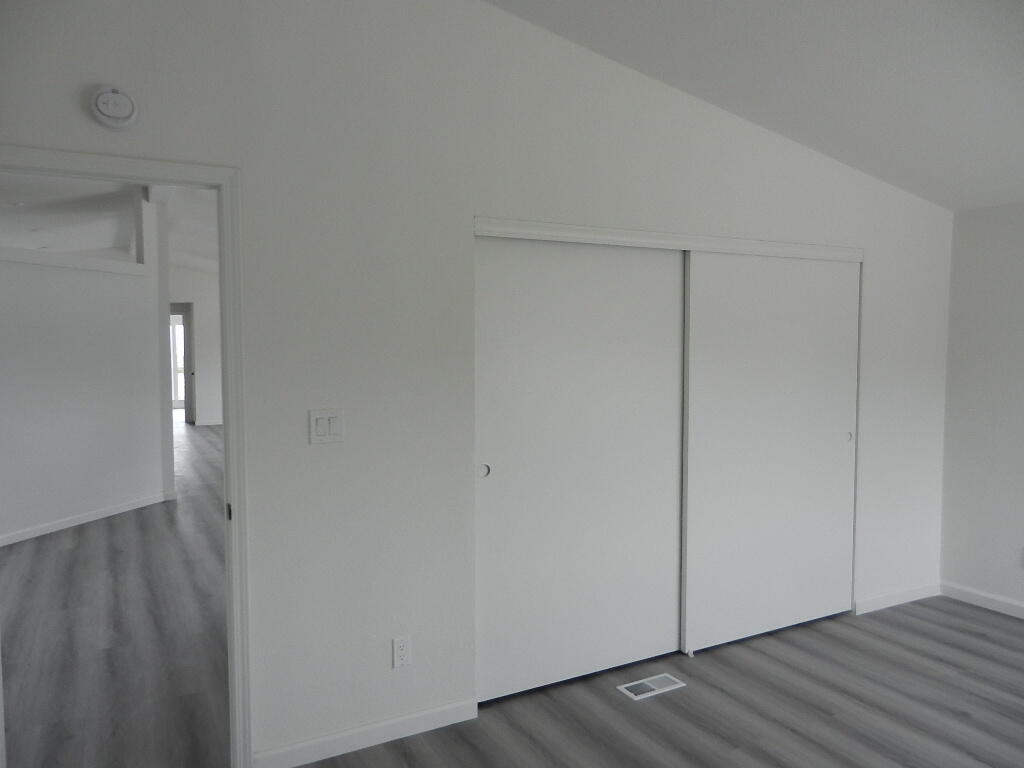 98920 Surfside Avenue Mecca, CA 92254 - Photo 19 of 22 a view of an empty room with wooden floor