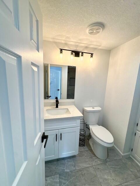 98920 Surfside Avenue Mecca, CA 92254 - Photo 21 of 22 a bathroom with a toilet sink and mirror