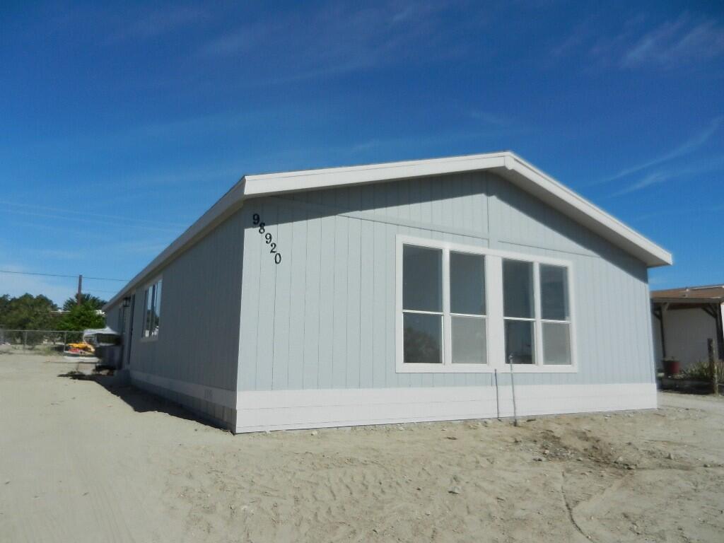 98920 Surfside Avenue Mecca, CA 92254 - Photo 3 of 22 a front view of a house with a yard