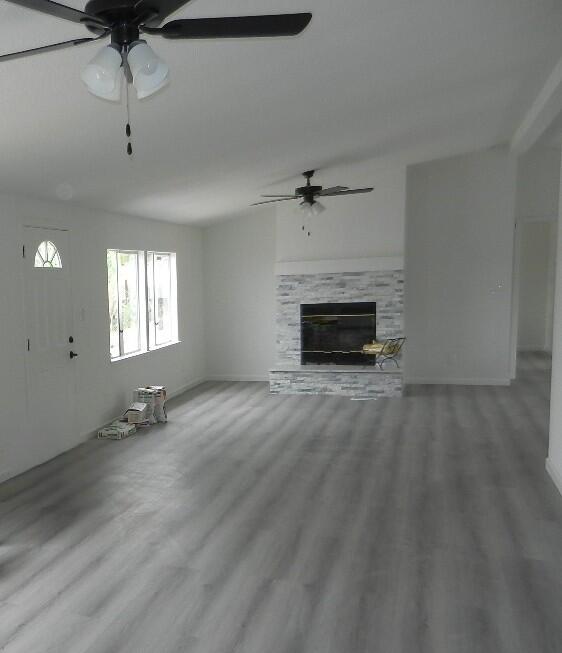 98920 Surfside Avenue Mecca, CA 92254 - Photo 6 of 22 an empty room with windows and fireplace