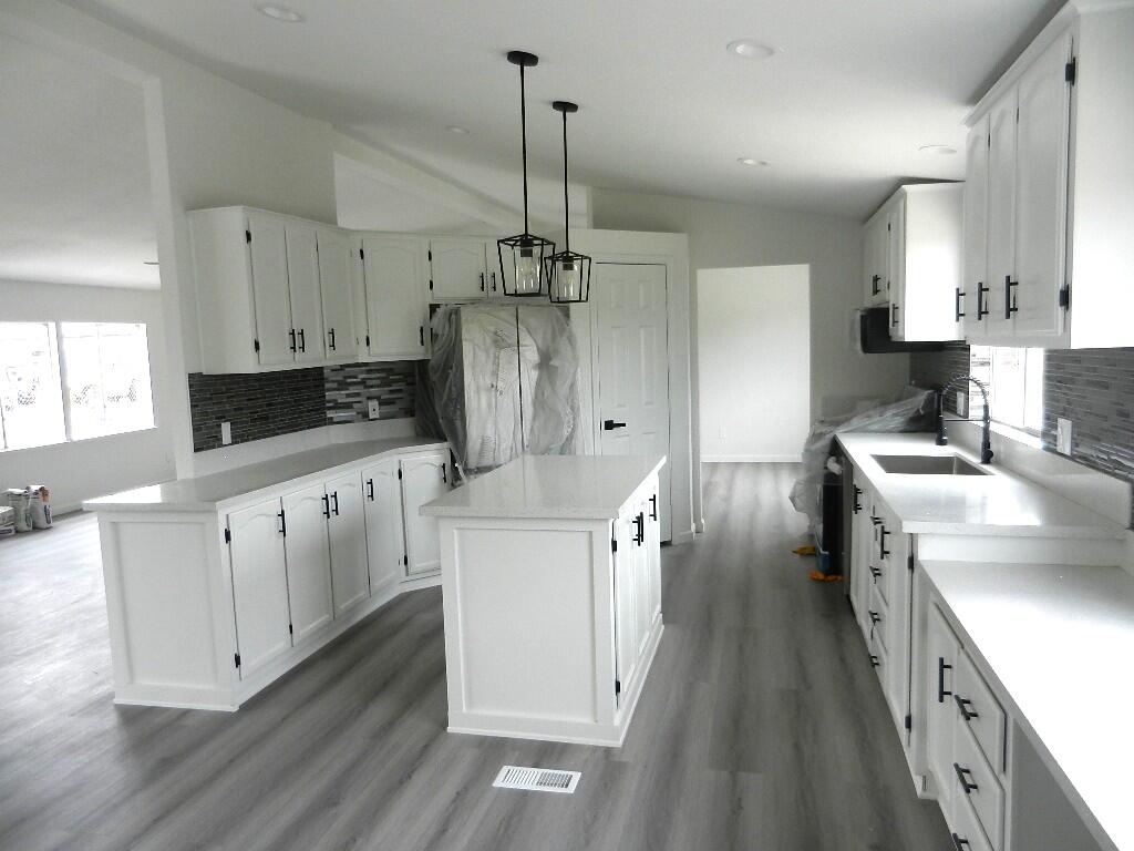 98920 Surfside Avenue Mecca, CA 92254 - Photo 8 of 22 a kitchen with granite countertop a sink stove and refrigerator