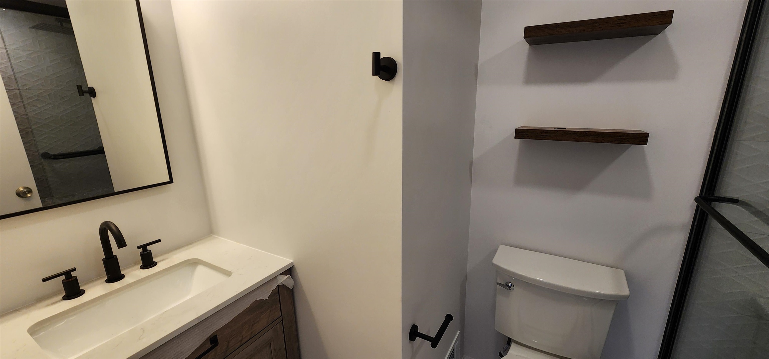 89 Harbor Key, Unit 89 Secaucus, NJ 07094 - Photo 11 of 17 a bathroom with a sink toilet and mirror