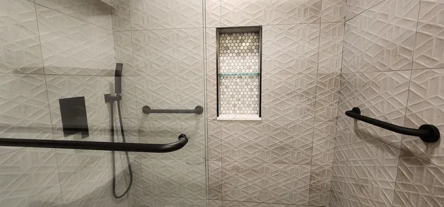 a bathroom with a shower and a sink
