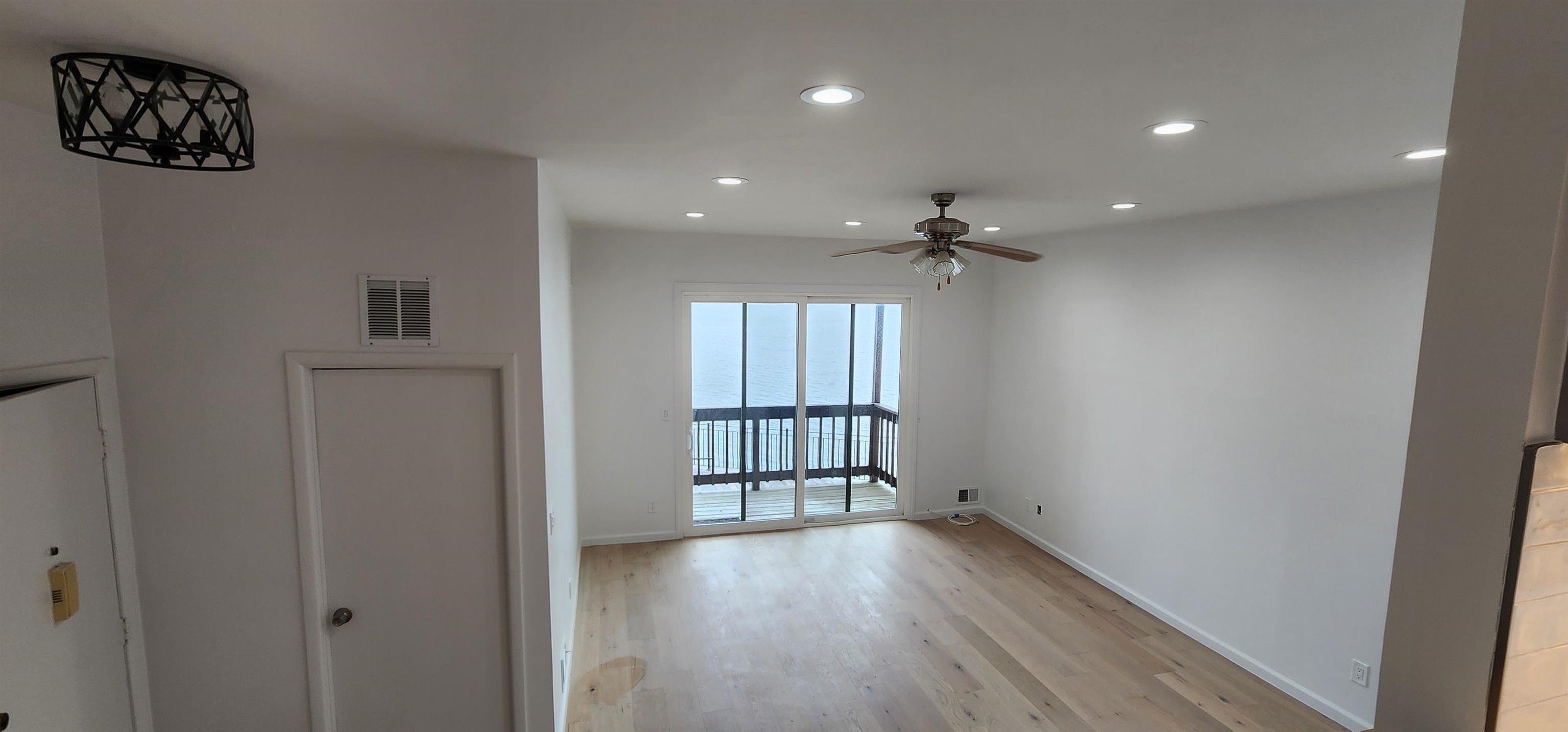 89 Harbor Key, Unit 89 Secaucus, NJ 07094 - Photo 3 of 17 wooden floor in an empty room with a window
