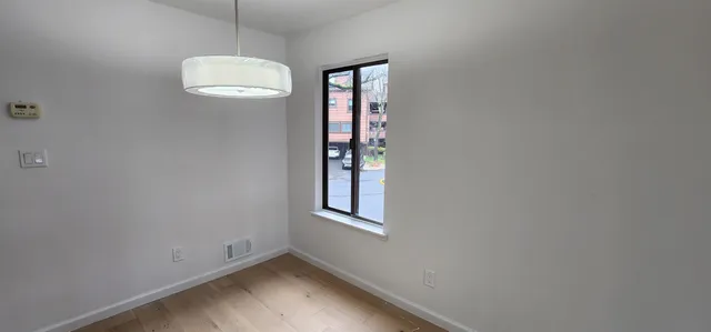 a kitchen with granite countertop a refrigerator stove and microwave