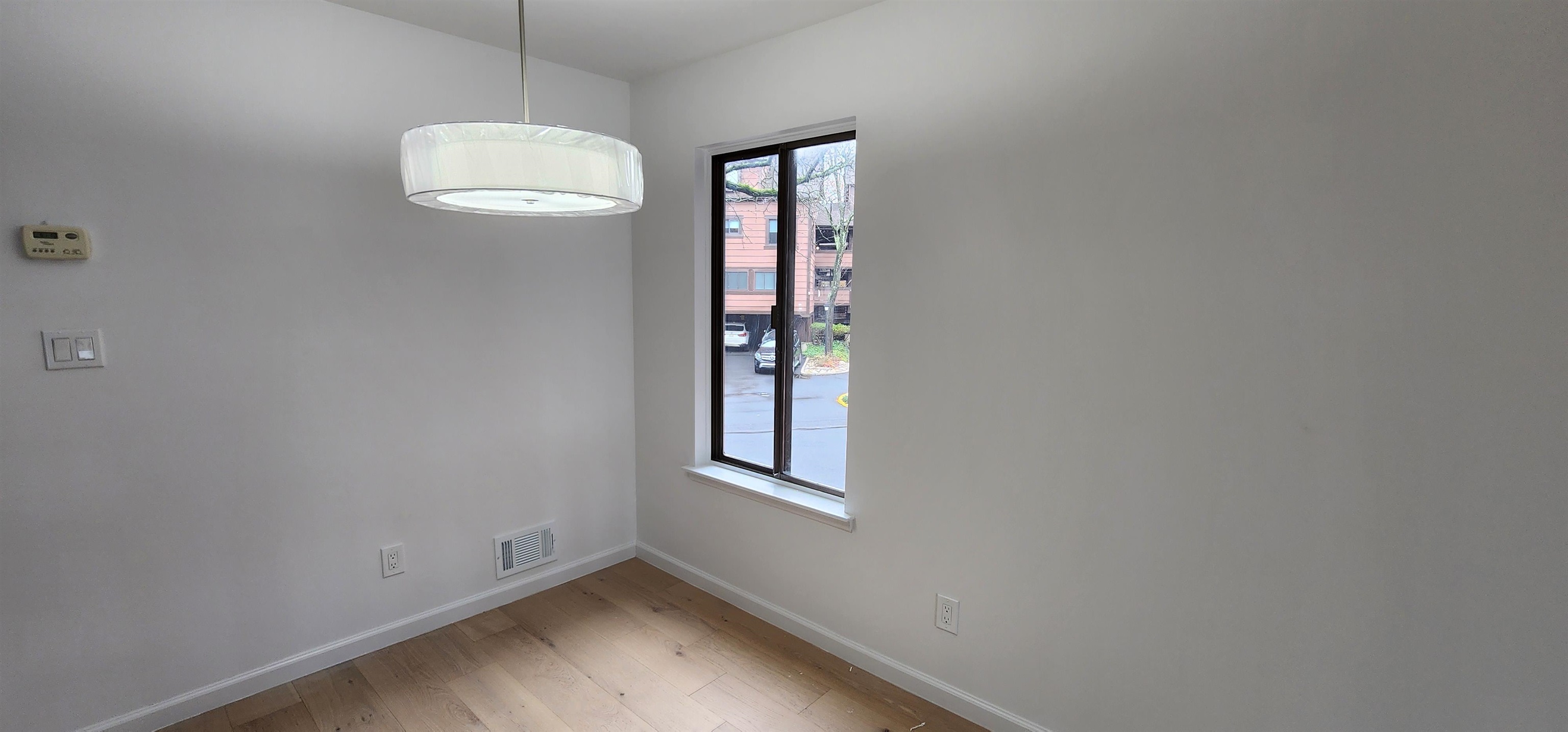 89 Harbor Key, Unit 89 Secaucus, NJ 07094 - Photo 8 of 17 an empty room with windows and closet