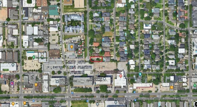 an aerial view of a house with outdoor space