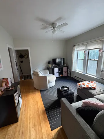 a living room with furniture and a window