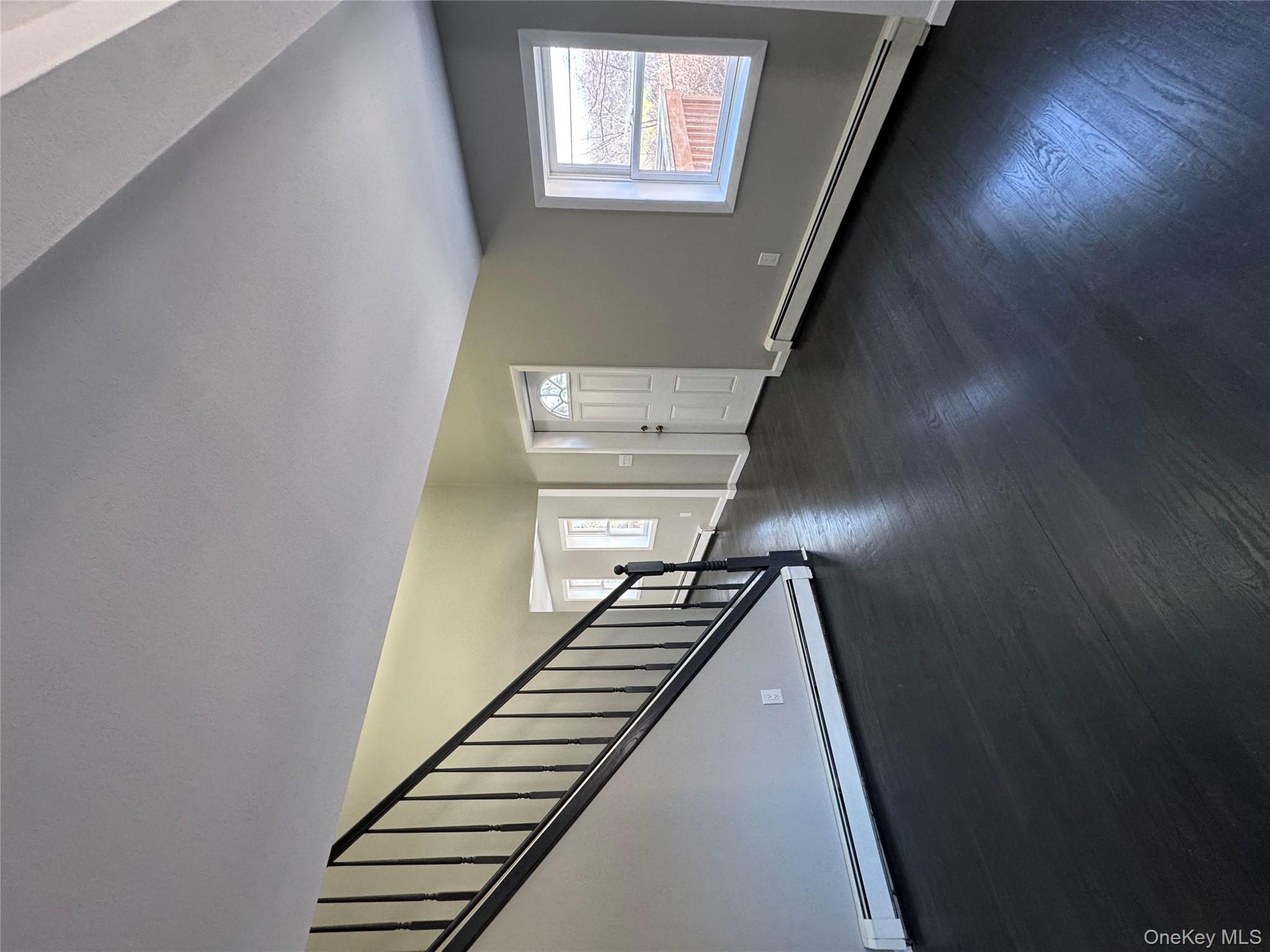 654 Milltown Road Danbury, CT 06811 - Photo 17 of 33 a view of an empty room with wooden floor and a window