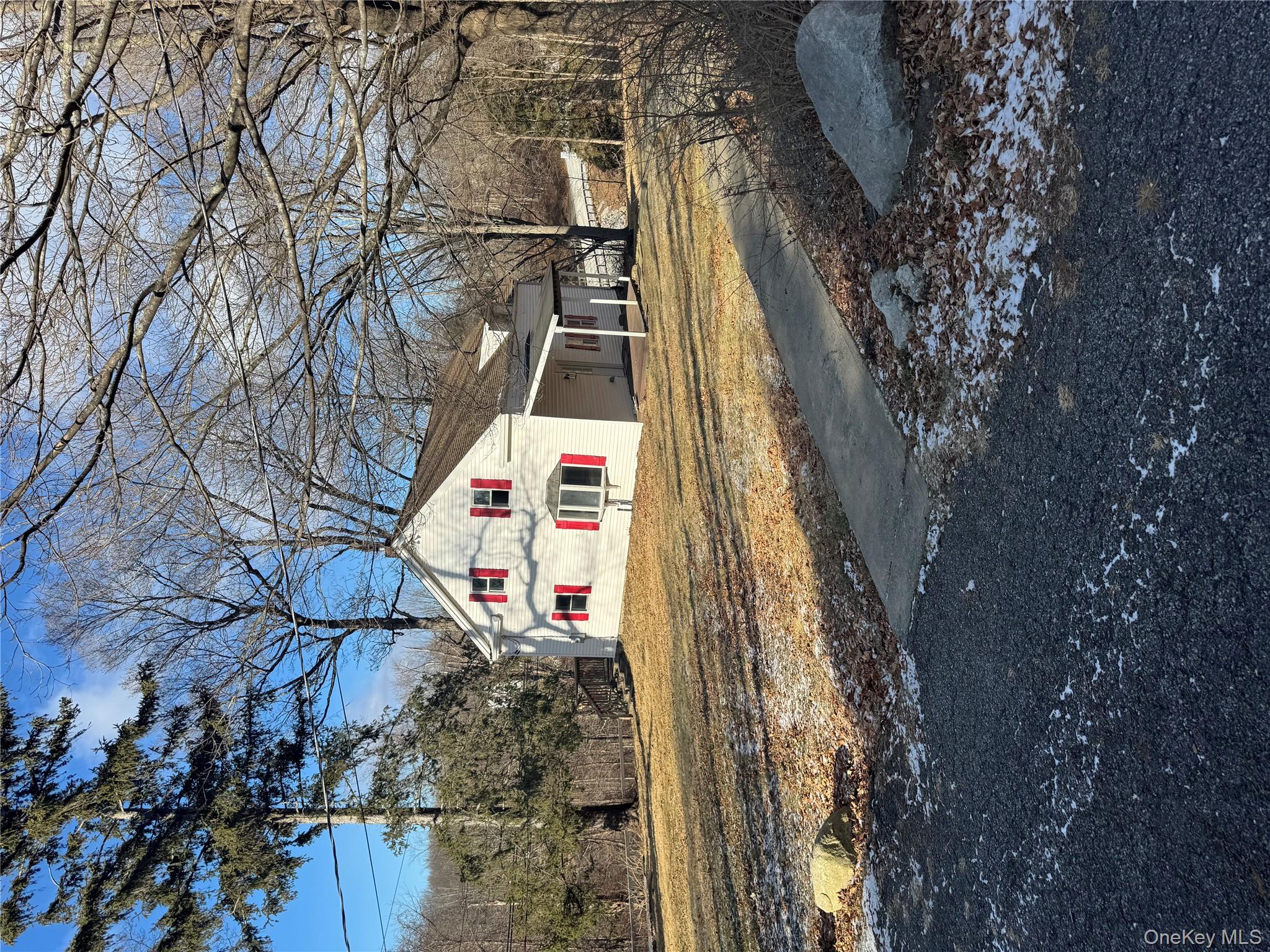 654 Milltown Road Danbury, CT 06811 - Photo 2 of 33 a sign board on the side of a road