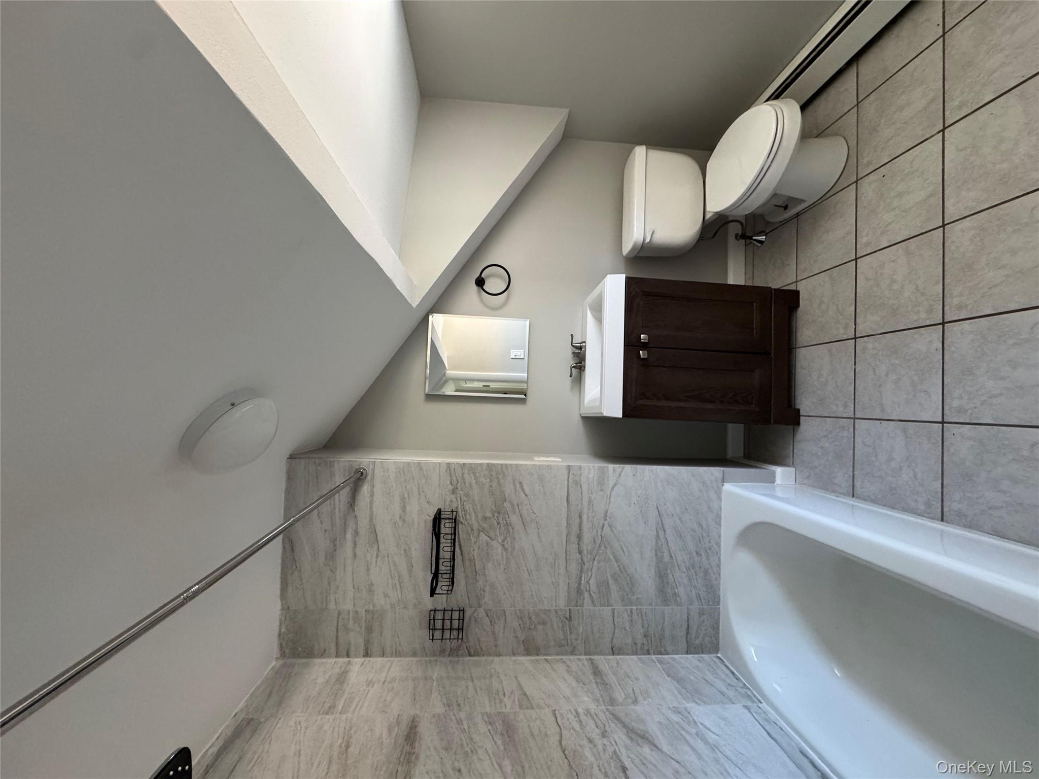 654 Milltown Road Danbury, CT 06811 - Photo 22 of 33 a bathroom with a sink a toilet and bathtub