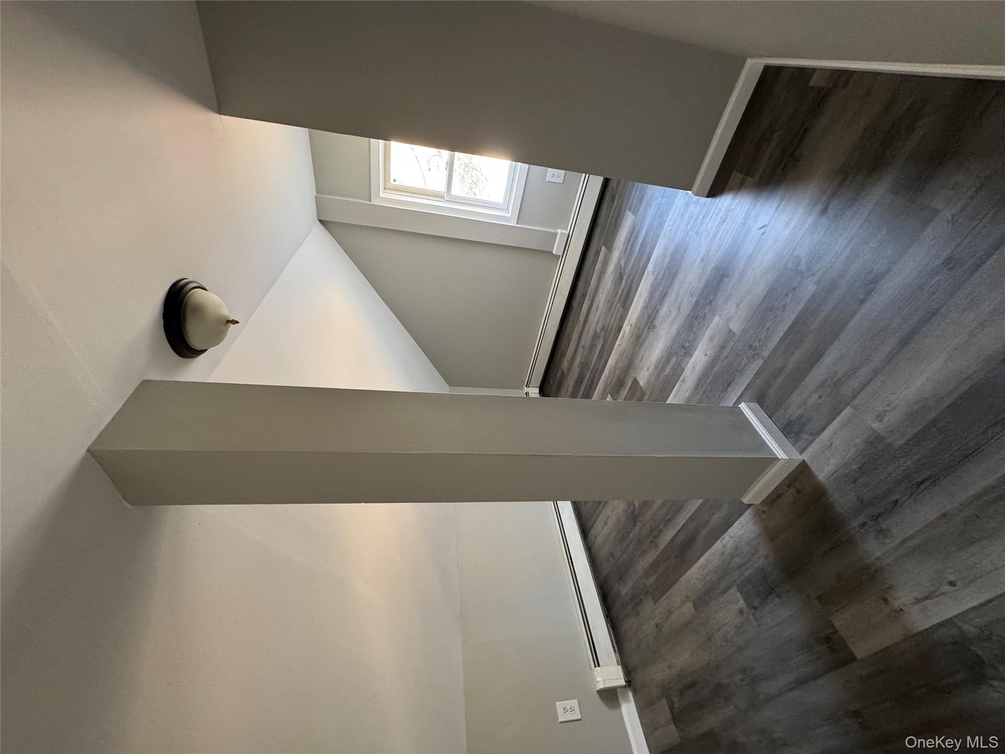 654 Milltown Road Danbury, CT 06811 - Photo 25 of 33 a view of an empty room with wooden floor