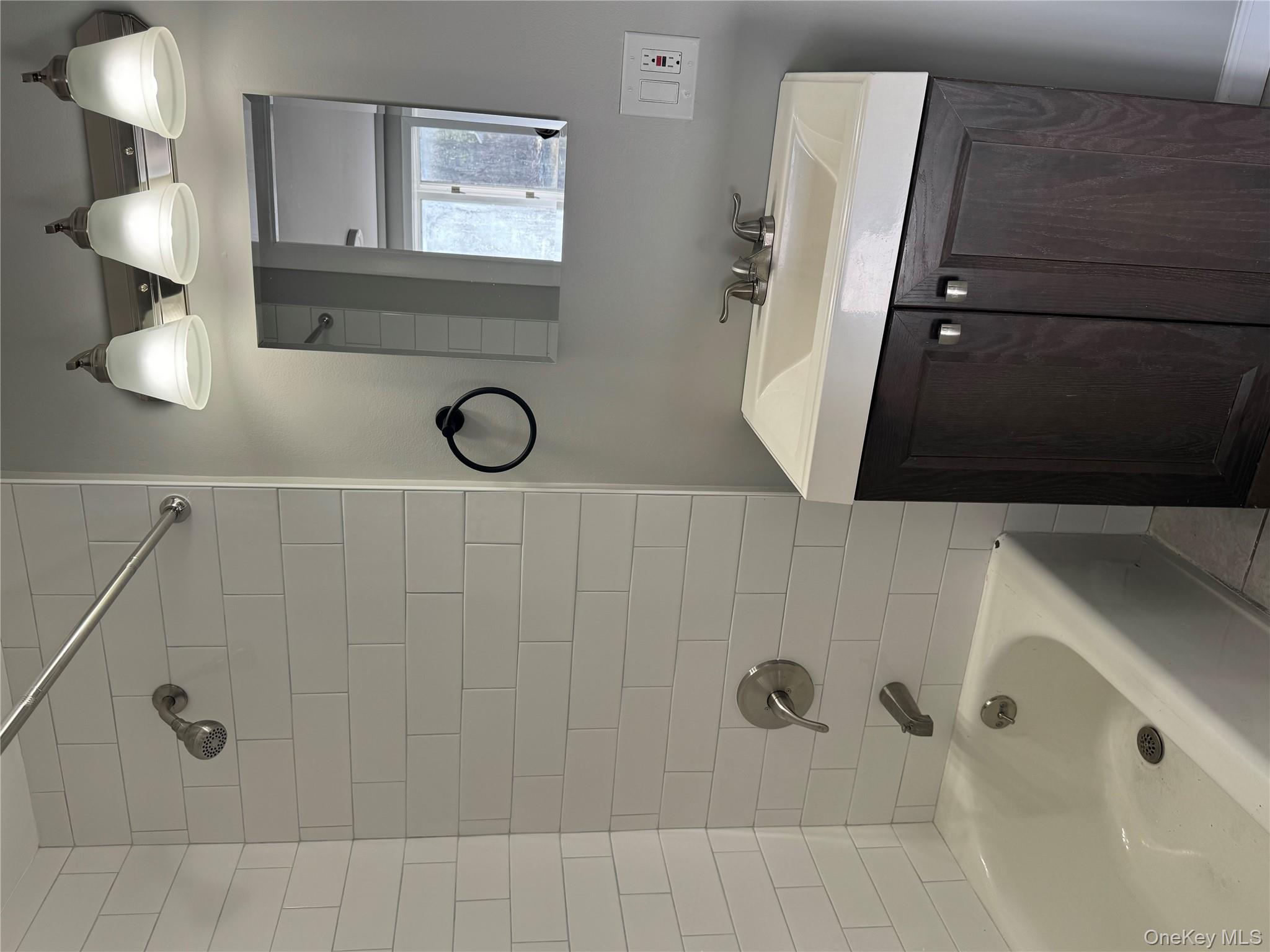 654 Milltown Road Danbury, CT 06811 - Photo 29 of 33 a bathroom with a sink and a bathtub