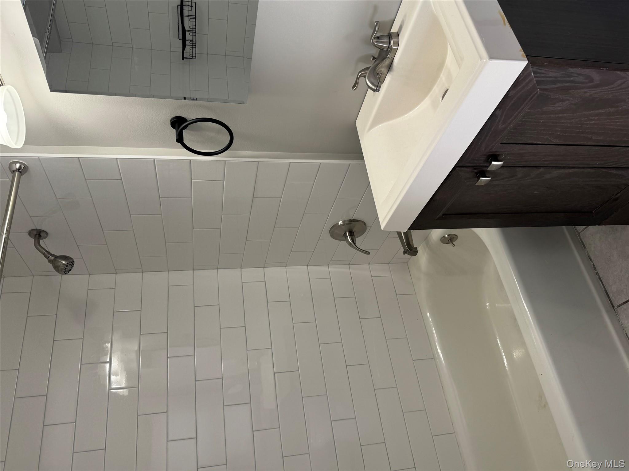 654 Milltown Road Danbury, CT 06811 - Photo 30 of 33 a bathroom with a sink vanity tub and shower