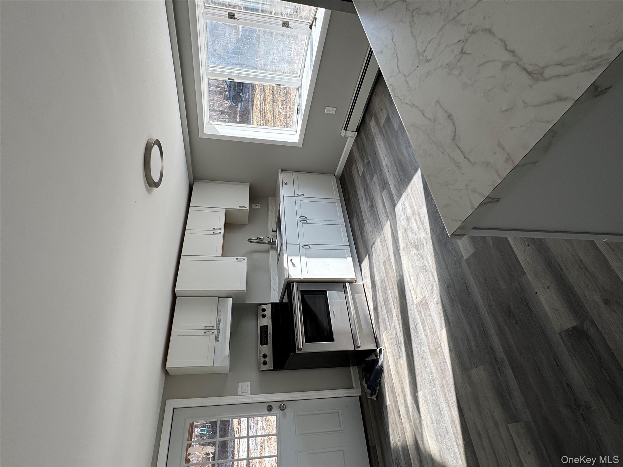 654 Milltown Road Danbury, CT 06811 - Photo 6 of 33 a kitchen with stainless steel appliances granite countertop a sink and a stove