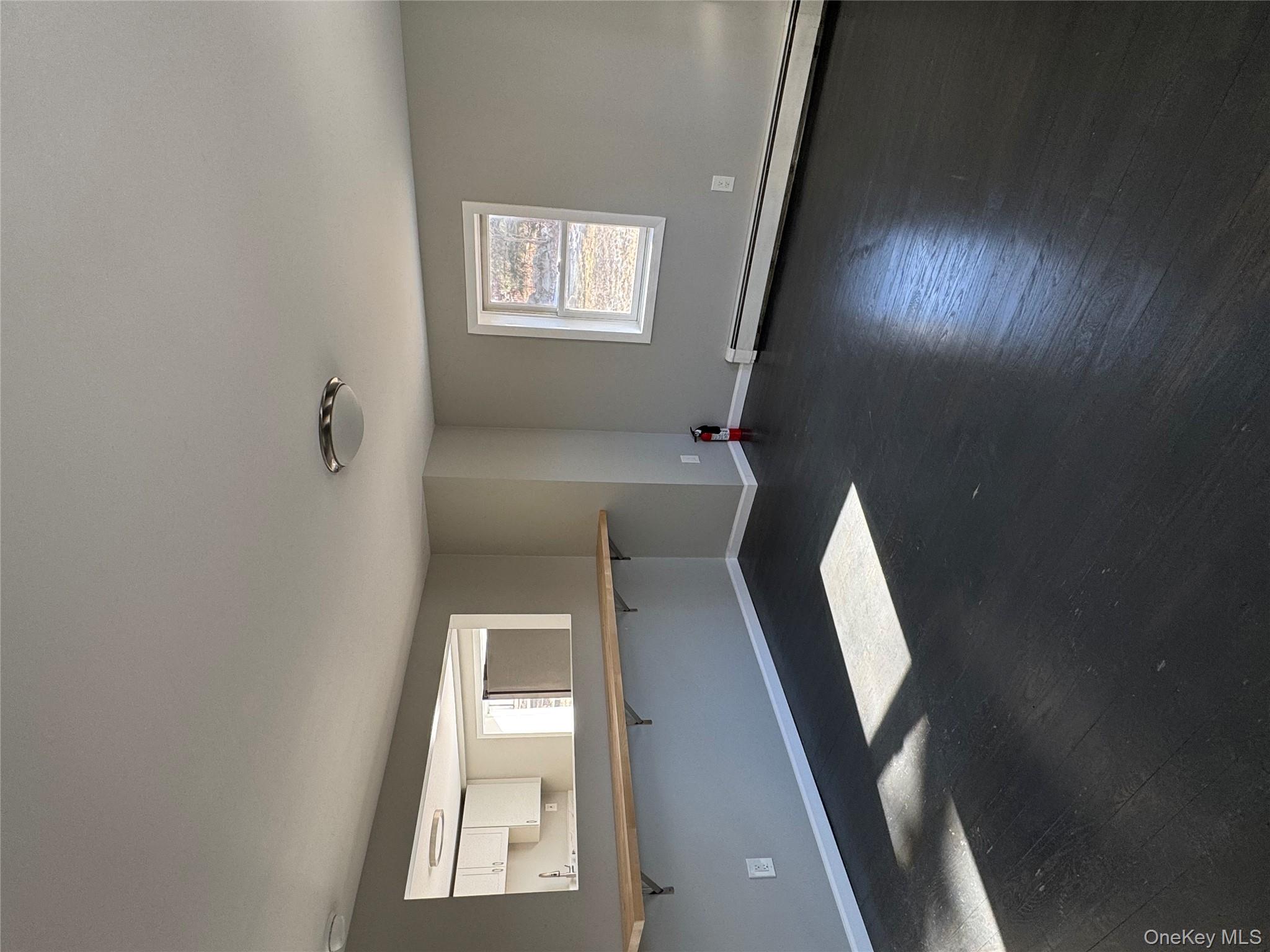 654 Milltown Road Danbury, CT 06811 - Photo 10 of 33 a view of a room with window and chandelier fan