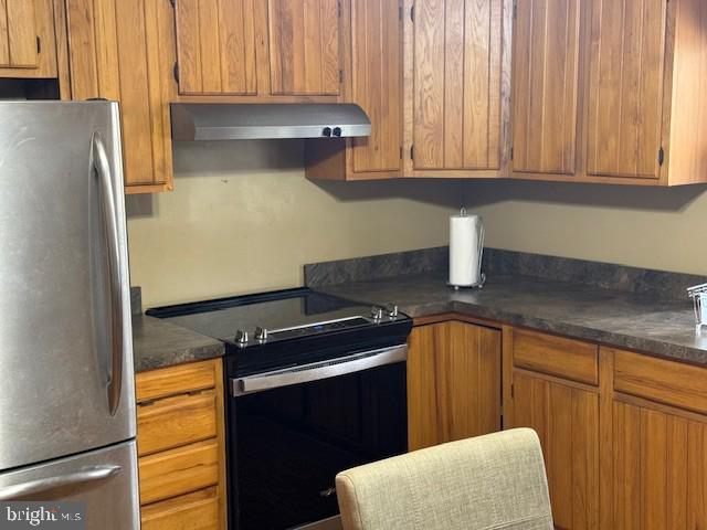 9285 Old Stagecoach Road La Plata, MD 20646 - Photo 3 of 14 a kitchen with stainless steel appliances granite countertop a refrigerator and a sink