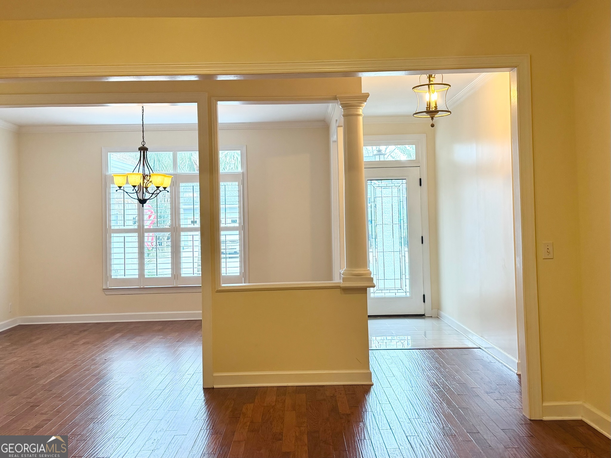 317 Commons Road St. Simons, GA 31522 - Photo 12 of 44 a view of an entryway with wooden floor