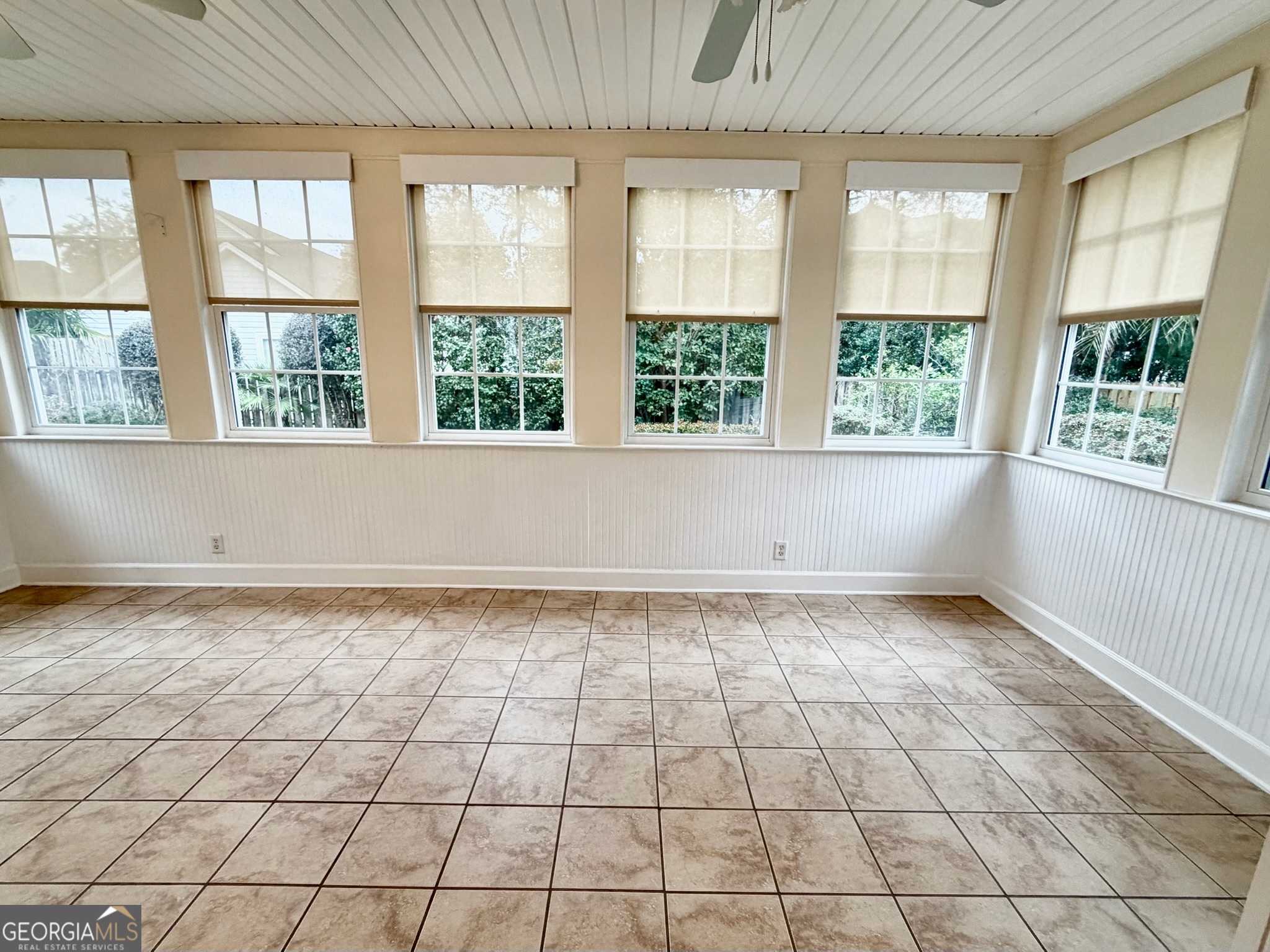 317 Commons Road St. Simons, GA 31522 - Photo 27 of 44 a view of an empty room with a window