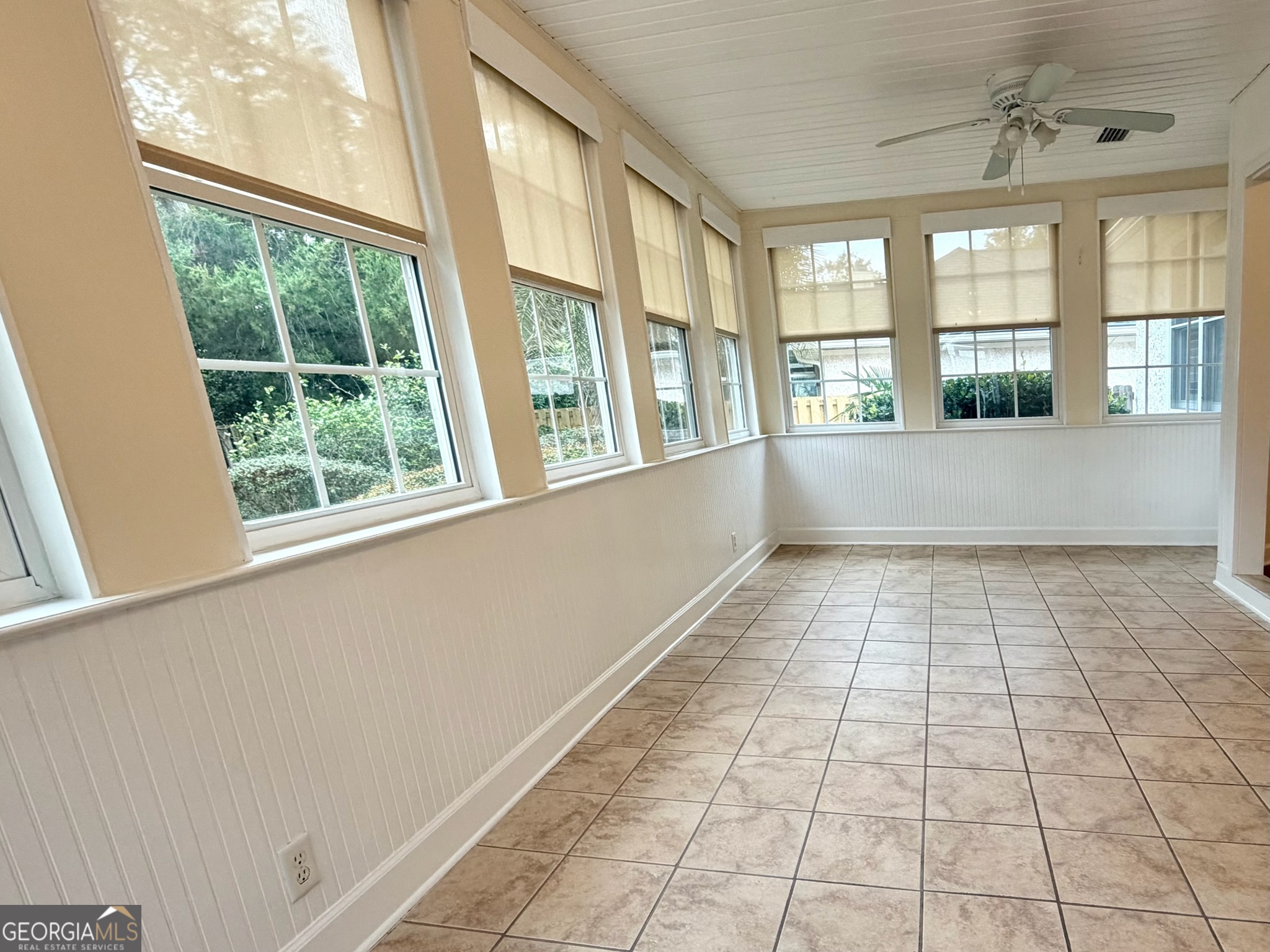 317 Commons Road St. Simons, GA 31522 - Photo 28 of 44 a view of an empty room with a window