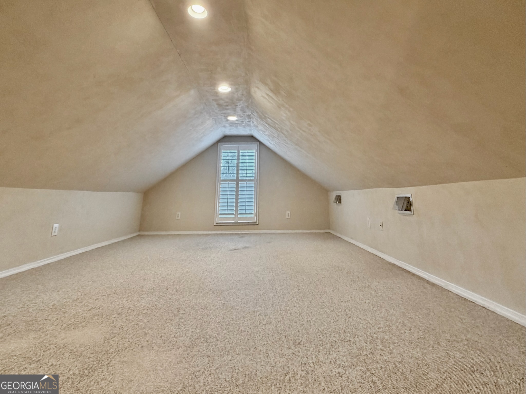 317 Commons Road St. Simons, GA 31522 - Photo 31 of 44 a view of an empty room with a window