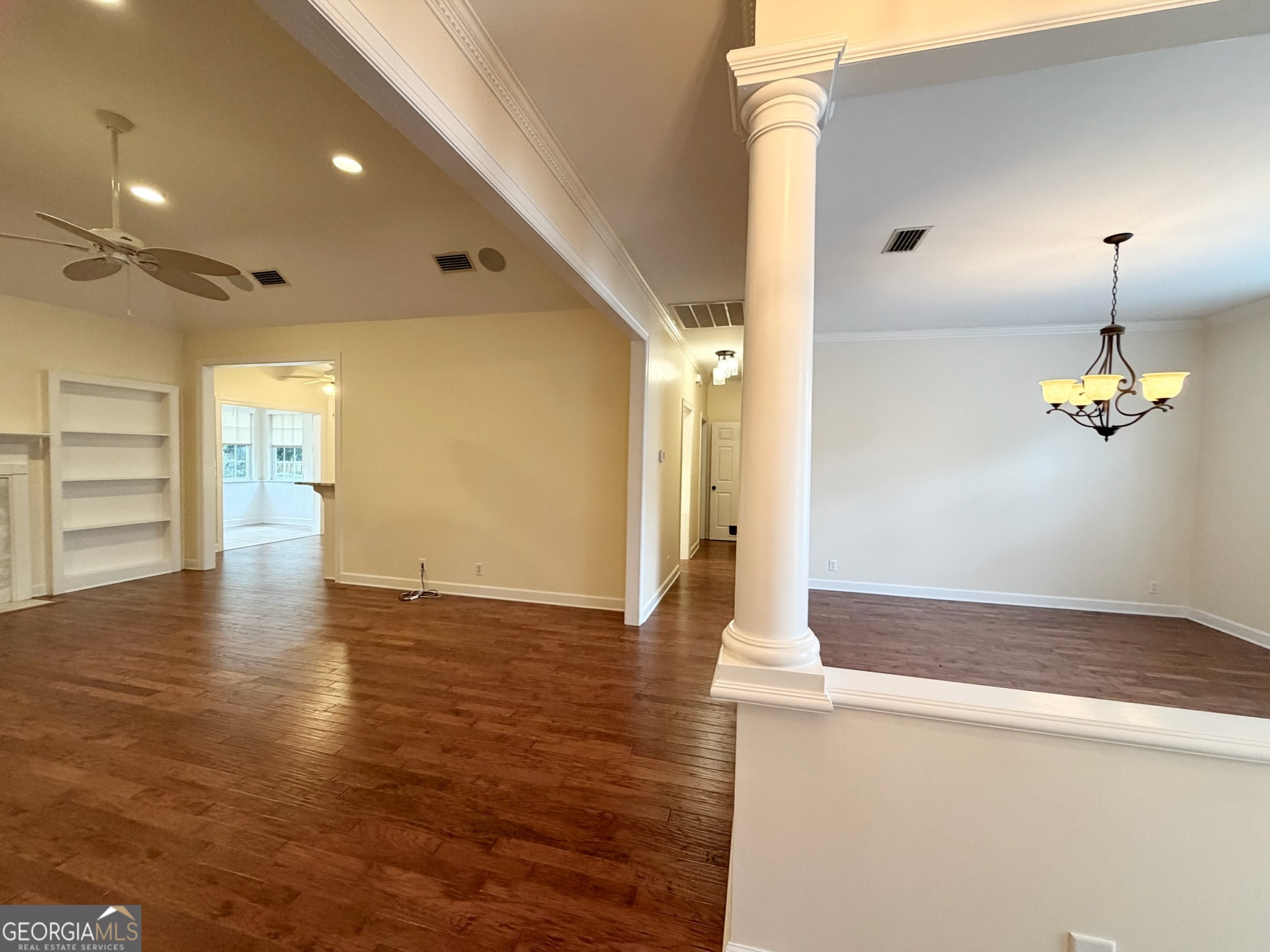 317 Commons Road St. Simons, GA 31522 - Photo 9 of 44 a view of empty room with wooden floor