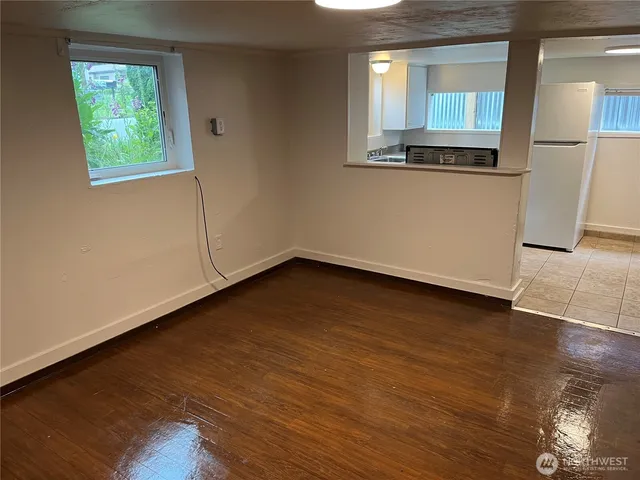 a kitchen with a stove sink and cabinets