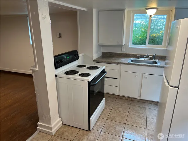 a view of hallway with wooden floor