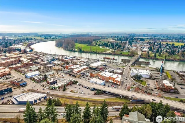an aerial view of a house with a ocean view
