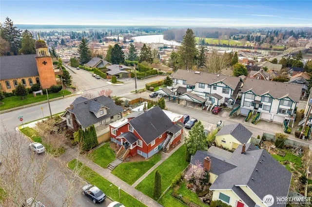 an aerial view of residential houses with outdoor space
