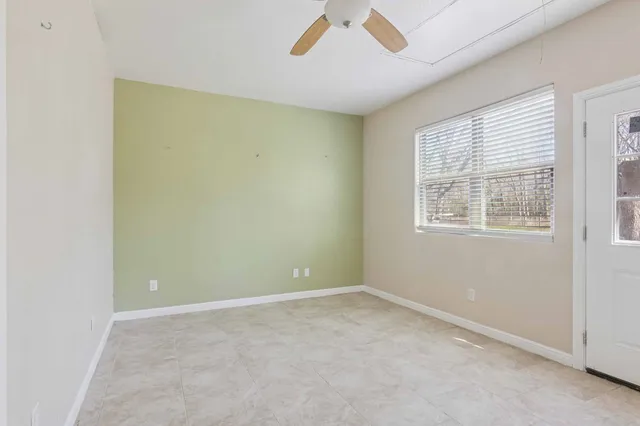 a view of an empty room with a window