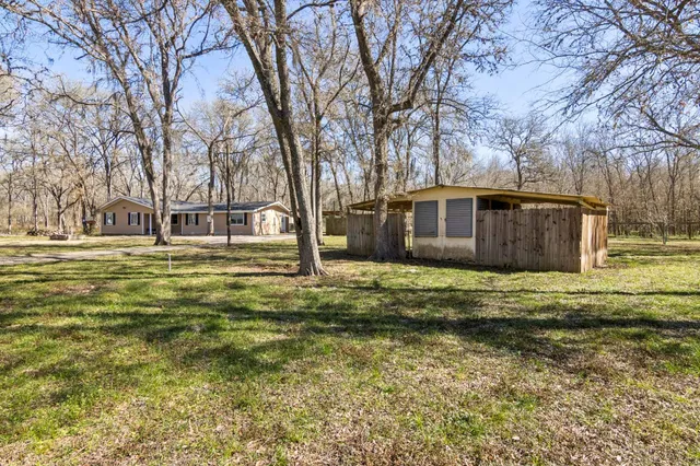 a house view with swimming pool